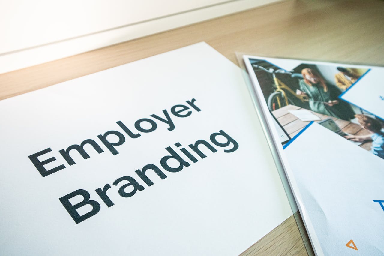 cta-bg Focus on employer branding with documents on a wooden desk, ideal for business concepts.
