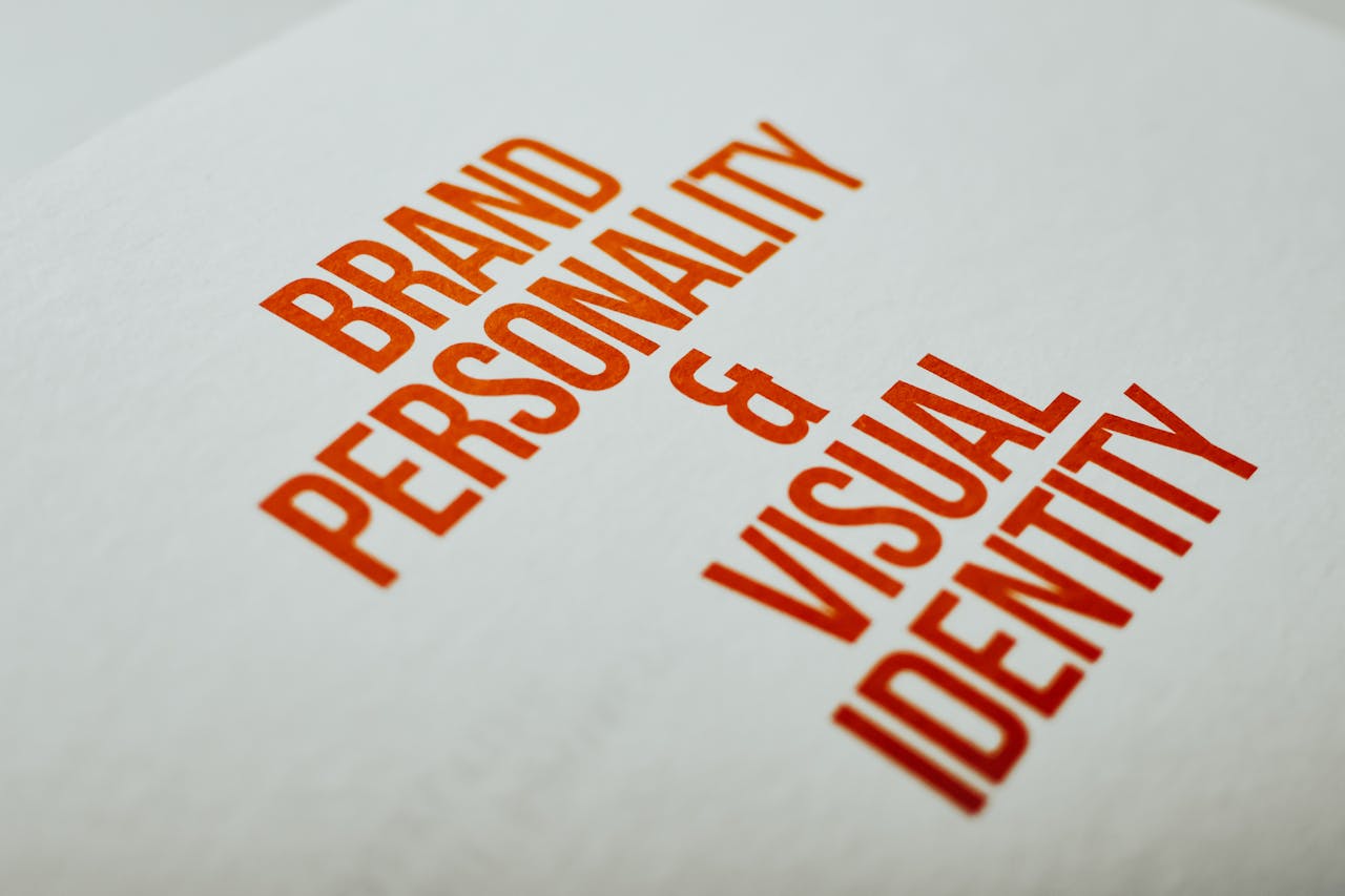 home-services-02 Close-up of Brand Personality & Visual Identity text in red on white paper.